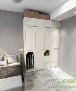 圓弧凹坑形的櫃門,在燈光的照射下會展示出不同的視覺效果,簡約中增添一抹設計感