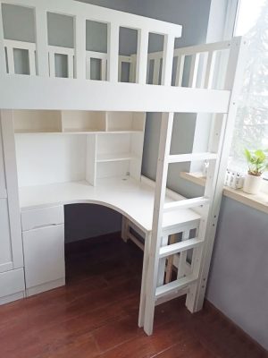 Physical photo: Book table and bookcase under white bed