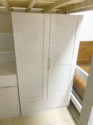 Physical photo: white bed under the wardrobe