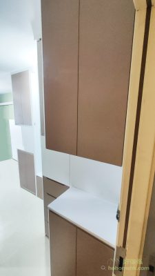 There is a cabinet of tall shoes near the door for easy storage of shoes and other necessities for going out.