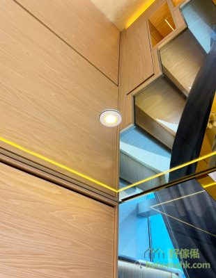 The floor of the attic is mirrored, with spotlights and light strips to increase the sense of space below.